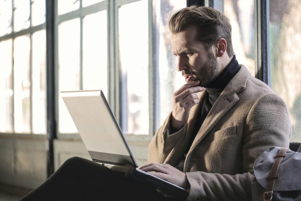 Professional man with a beard and a laptop